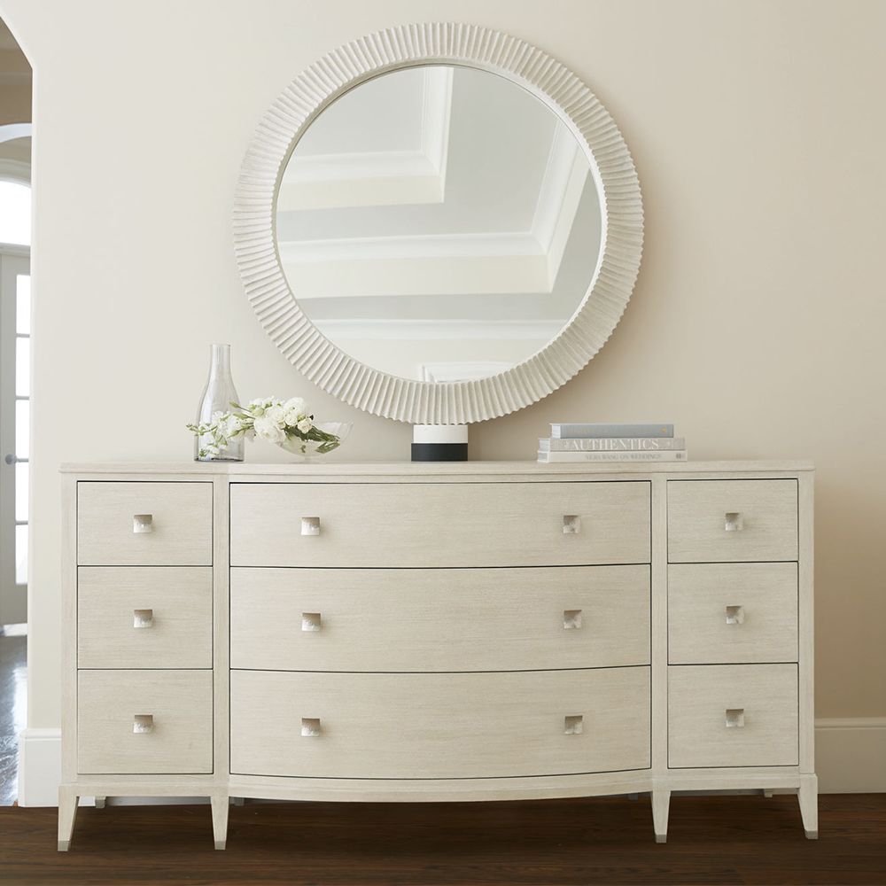 A gorgeous dresser from Bernhardt with a natural finish, tarnished nickel accents and nine drawers