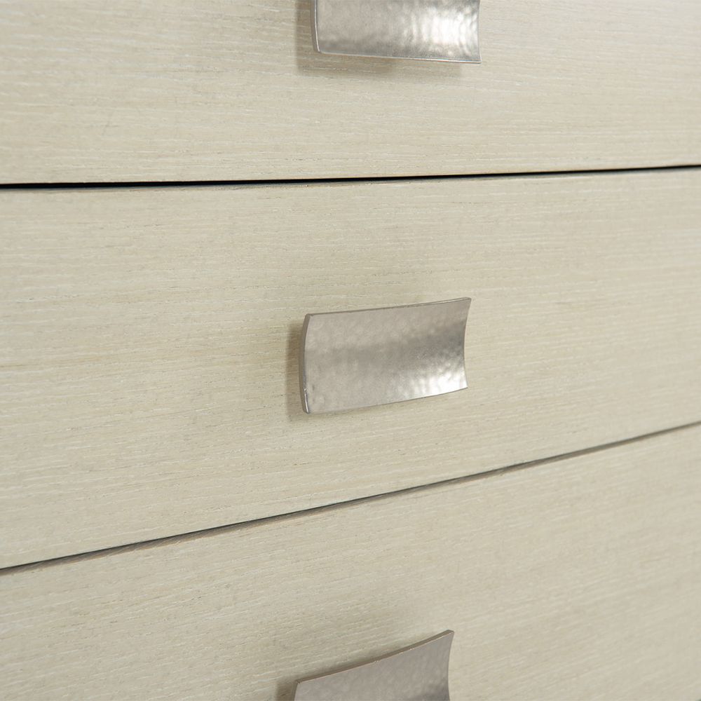 A beautiful chest of drawers from Bernhardt with five drawers and tarnished nickel handles 