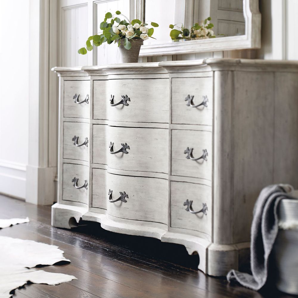 A beautiful and classic French style dresser with nine drawers and lovely curved front and ends from Bernhardt 