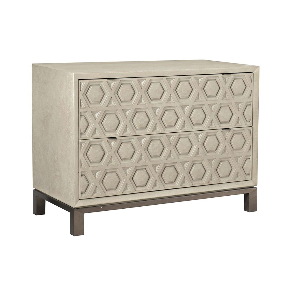 A unique two drawer chest of drawers from Bernhardt with a textured geometric design and stainless steel base with a nickel finish 