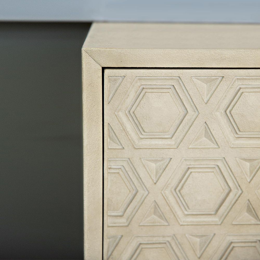 A unique two drawer chest of drawers from Bernhardt with a textured geometric design and stainless steel base with a nickel finish 