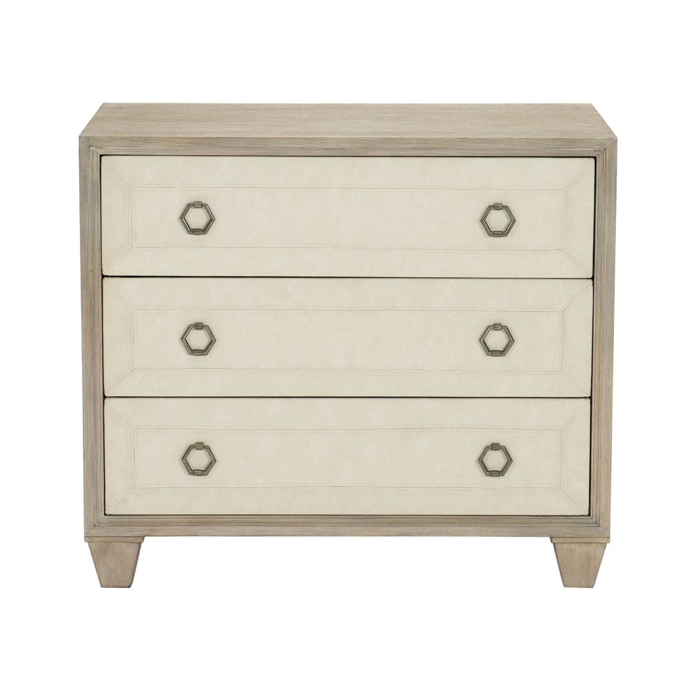 A stylish natural wood bedside table with performance fabric and tarnished nickel handles 