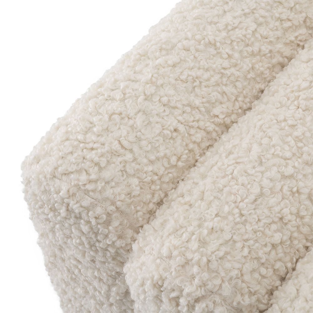 A luxurious, faux shearling Bente stool by Eichholtz