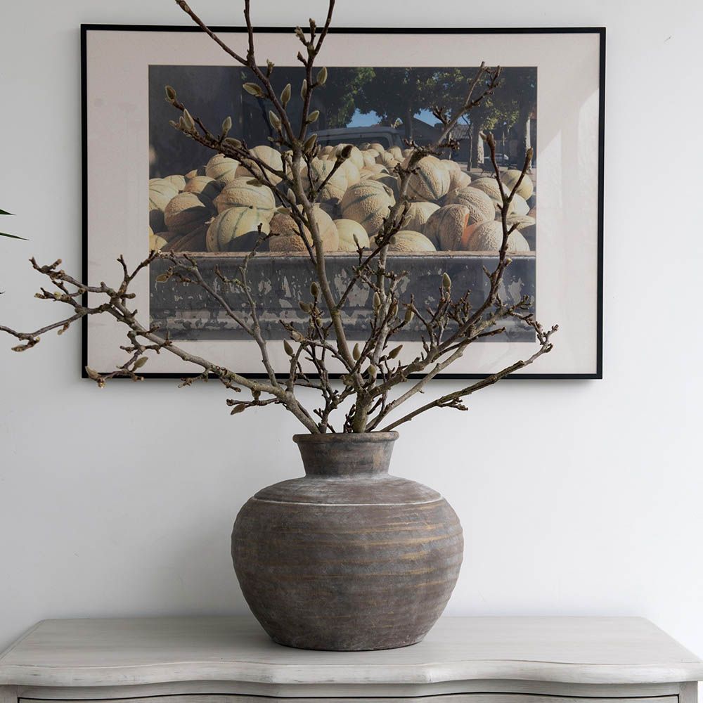 Elegant rounded brown vase with a natural finish
