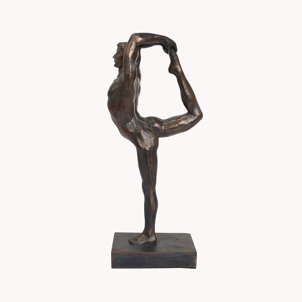 An elegant decorative statue which depicts a dance pose and bronze finish 