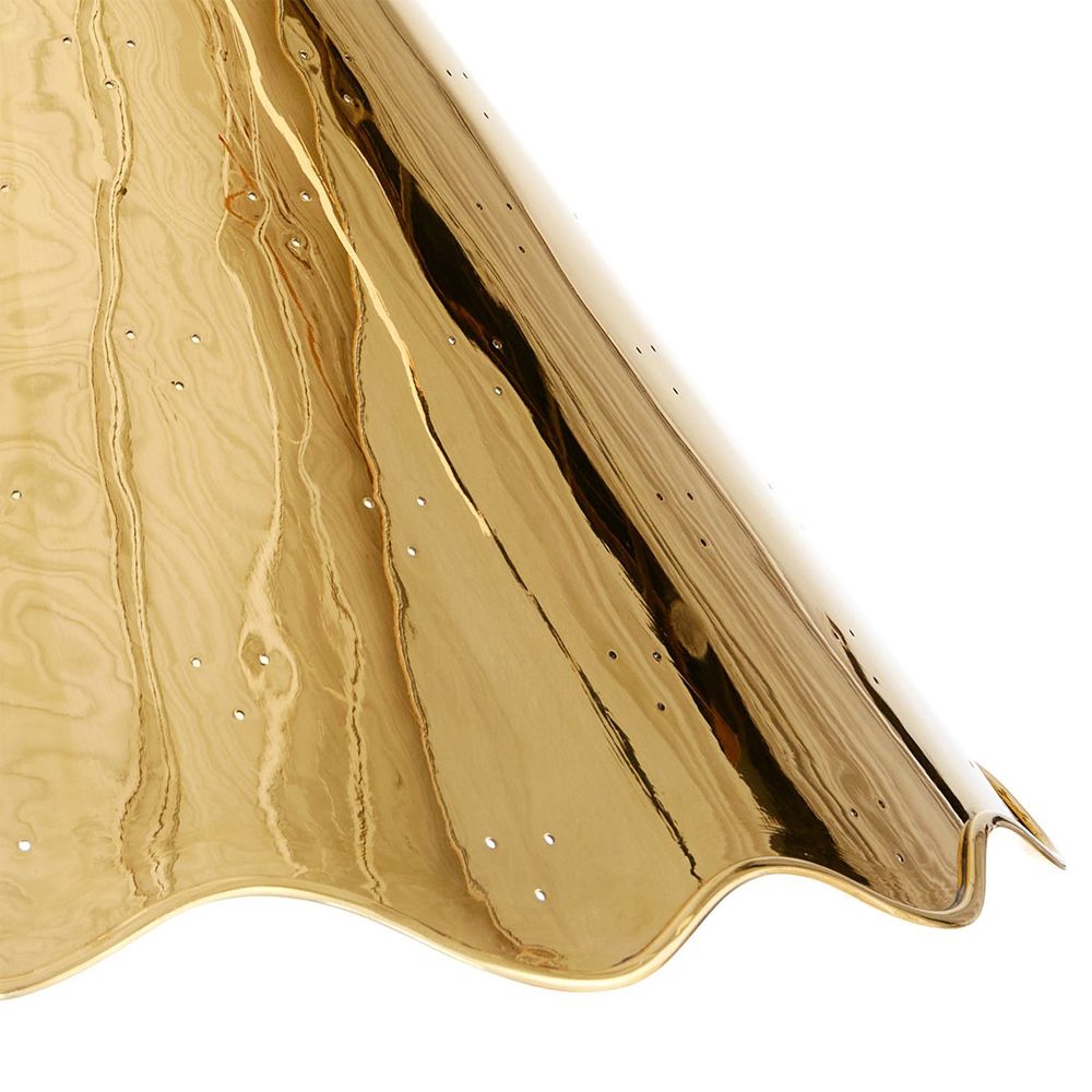 A glamorous, modern ceiling lamp with a rippled edge and perforated details