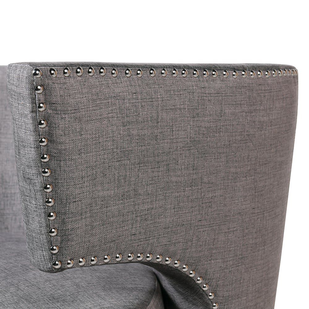 an occasional wingback armchair with silver studding 