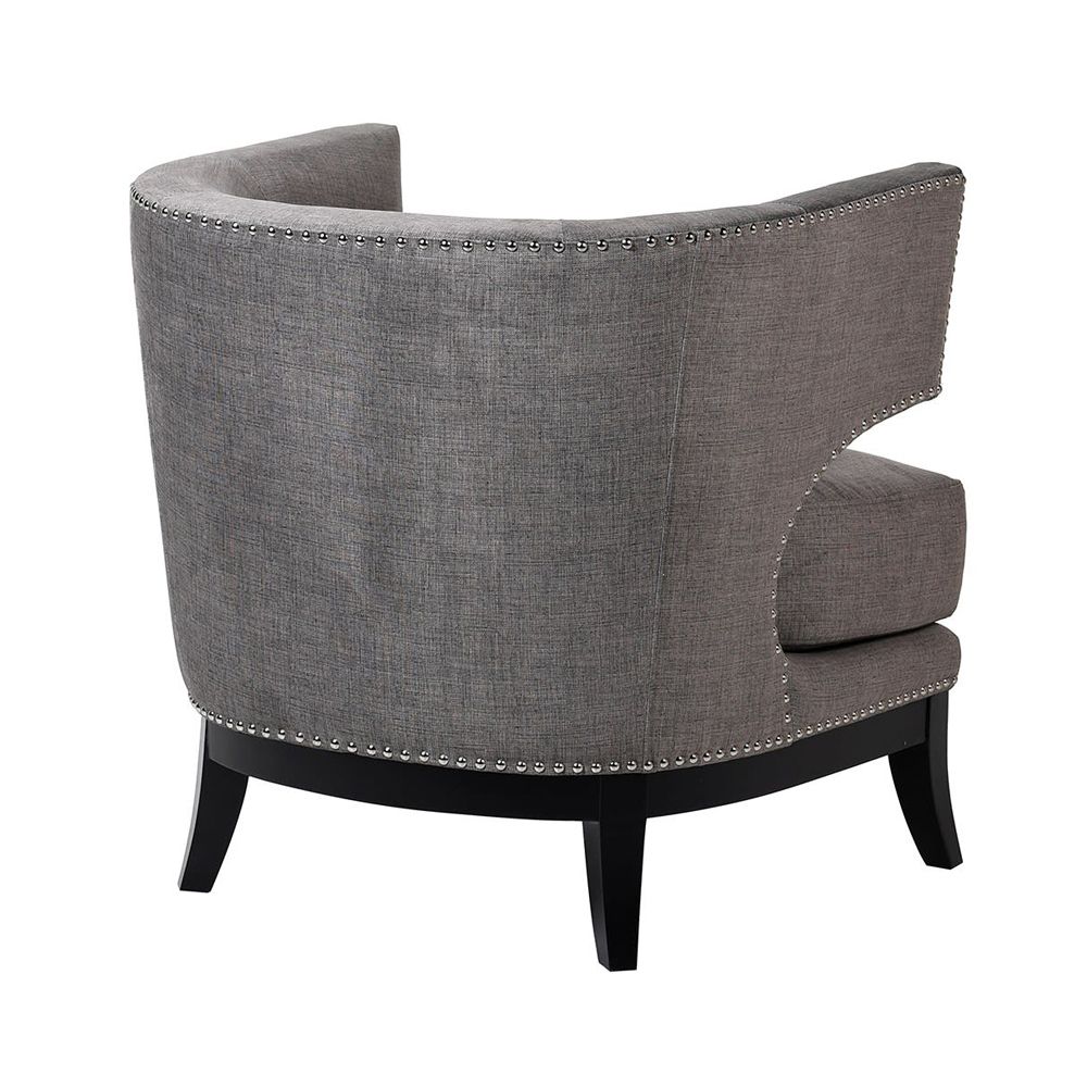 an occasional wingback armchair with silver studding 
