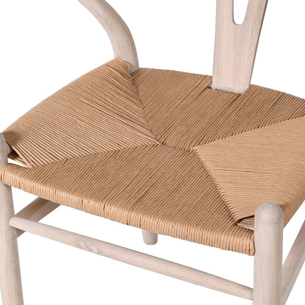 A sophisticated, Scandinavian-style chair with a open back design and natural finish