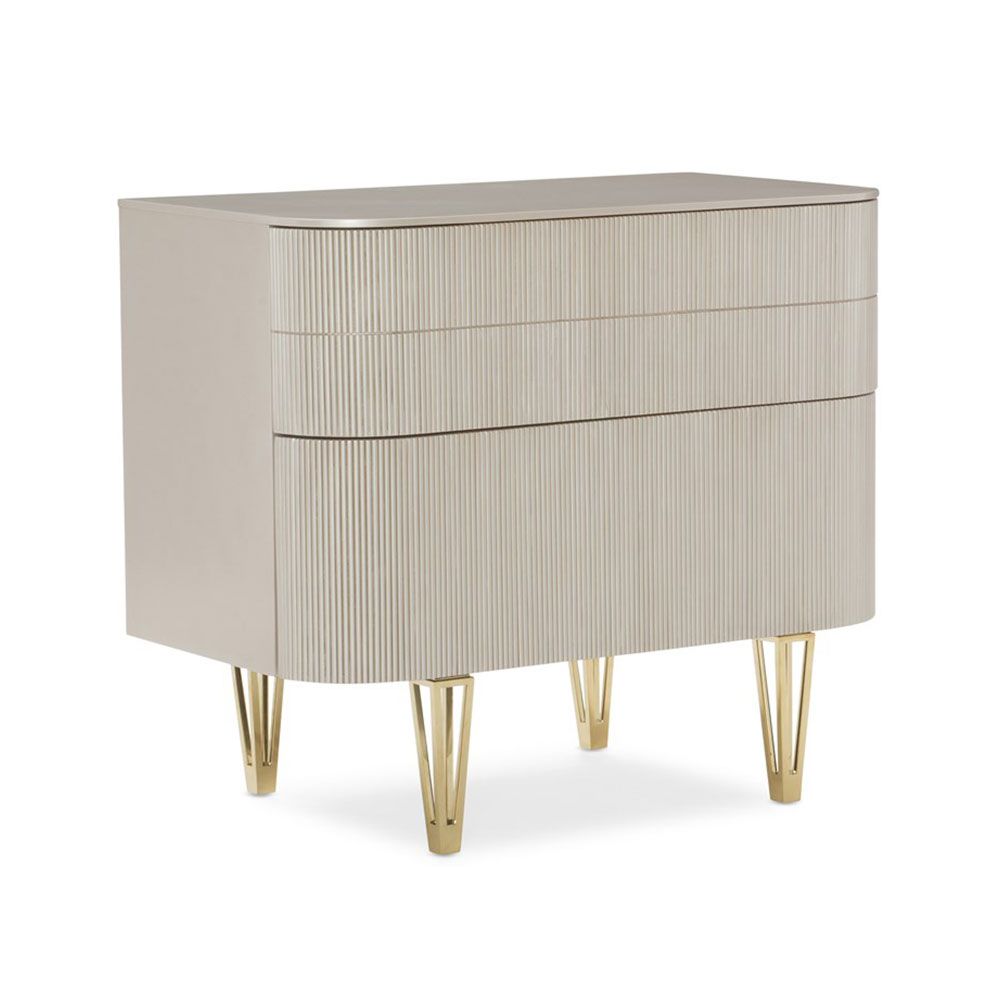 Stunningly elegant ribbed bedside table with glamorous gold feet details