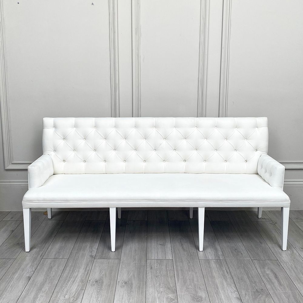 A luxurious linen-upholstered bench with white legs
