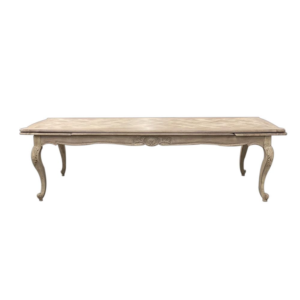 French-style dining table with parquet detailed surface and some imperfections