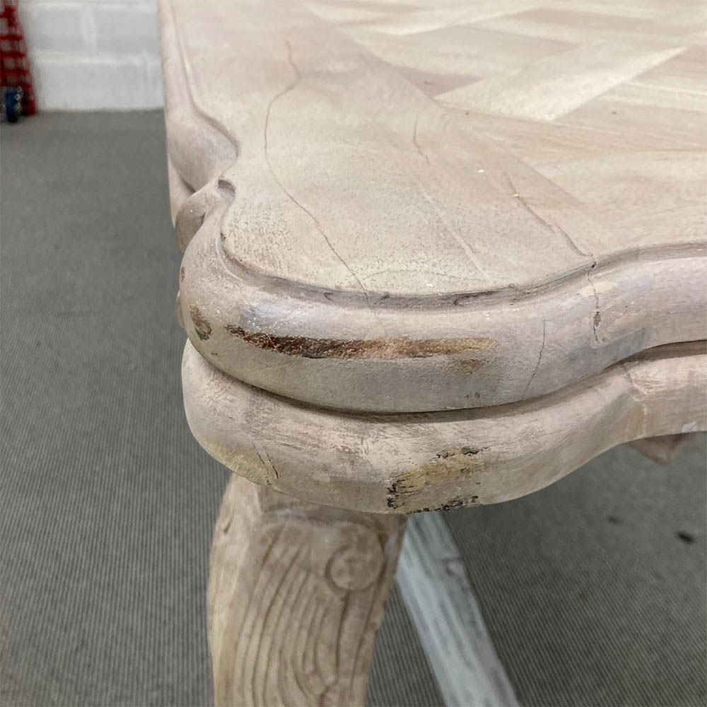 French-style dining table with parquet detailed surface and some imperfections