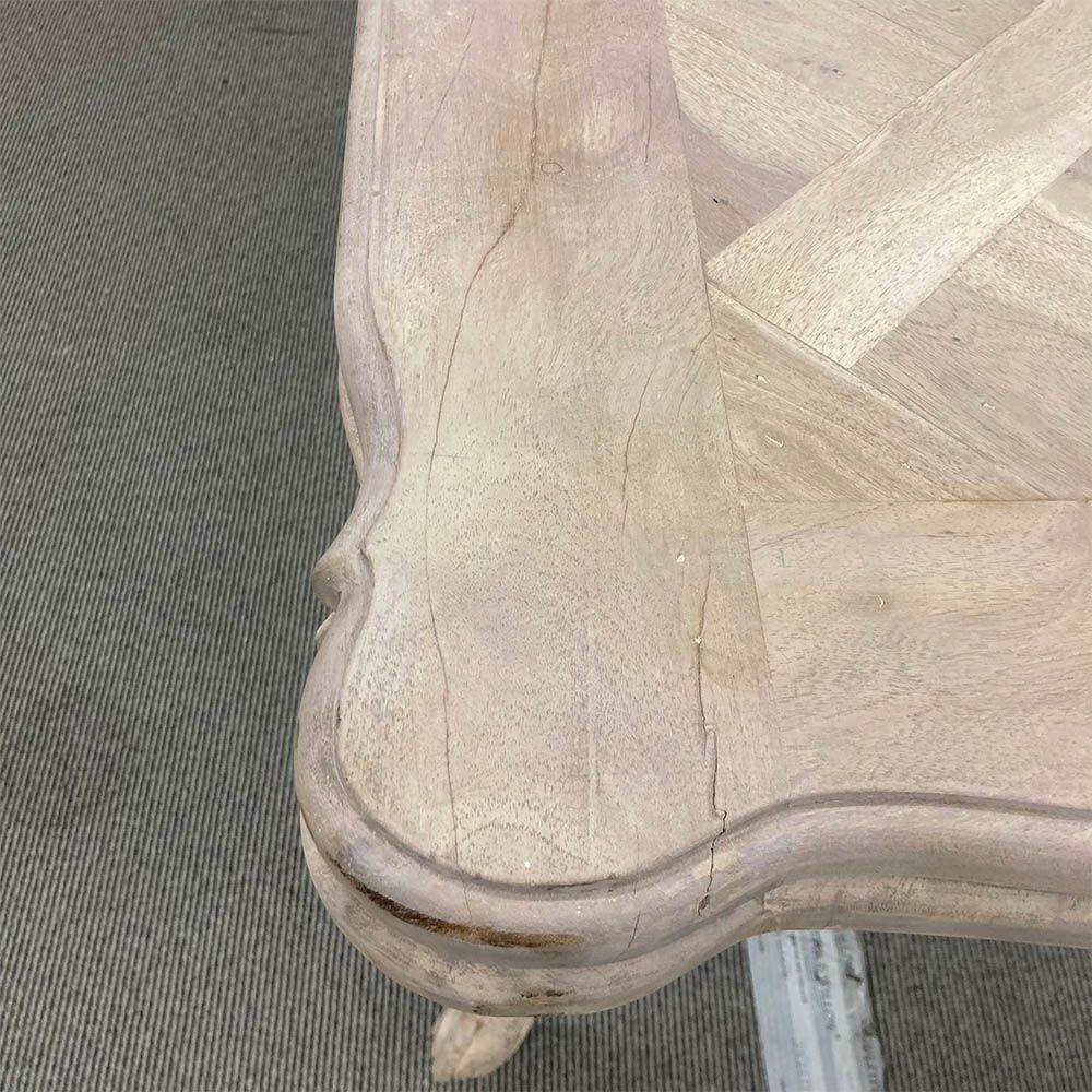 French-style dining table with parquet detailed surface and some imperfections