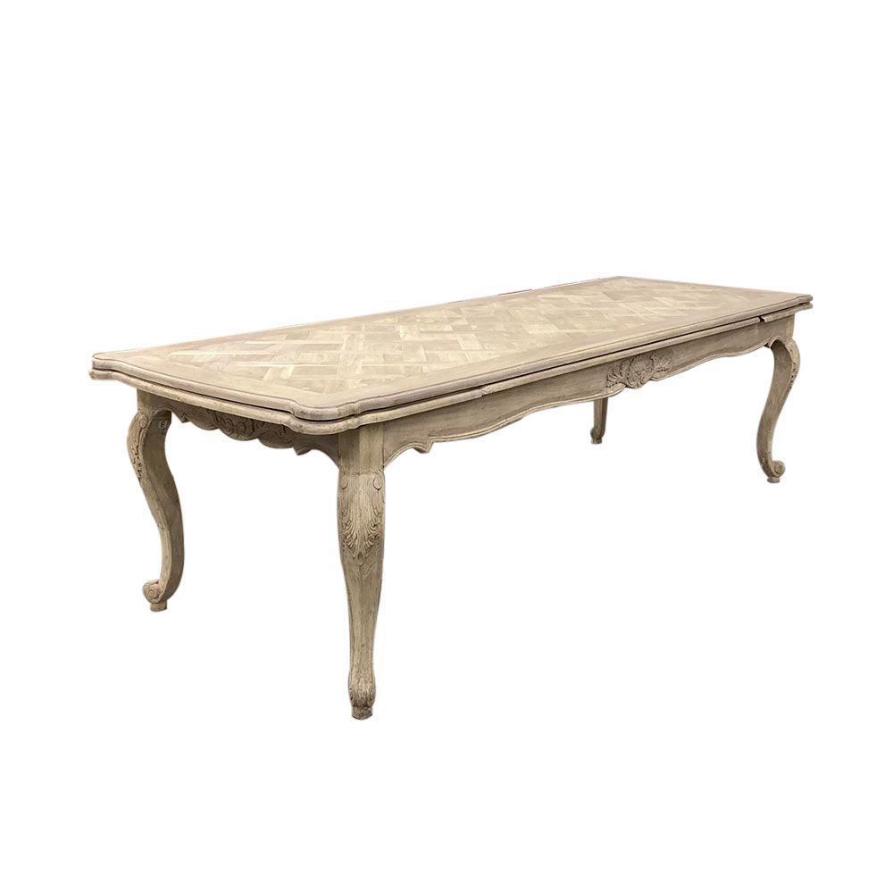 French-style dining table with parquet detailed surface and some imperfections