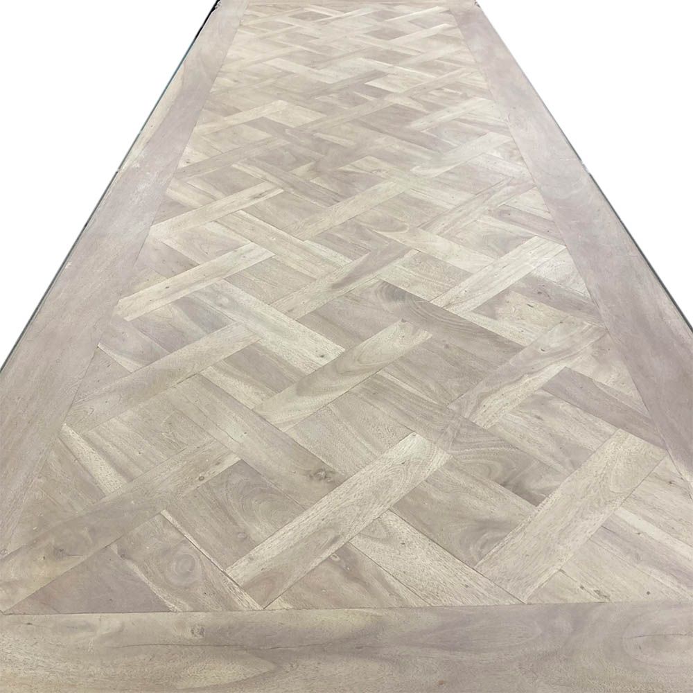 French-style dining table with parquet detailed surface and some imperfections