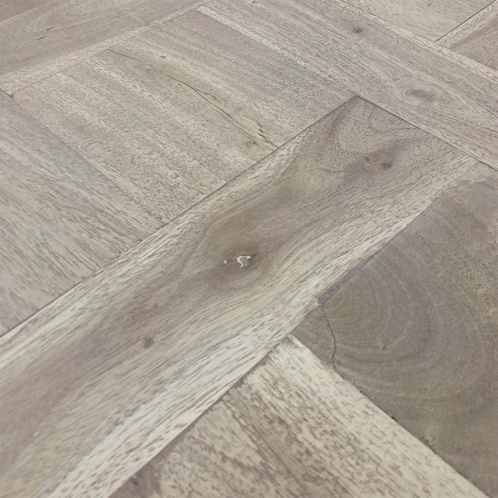 French-style dining table with parquet detailed surface and some imperfections