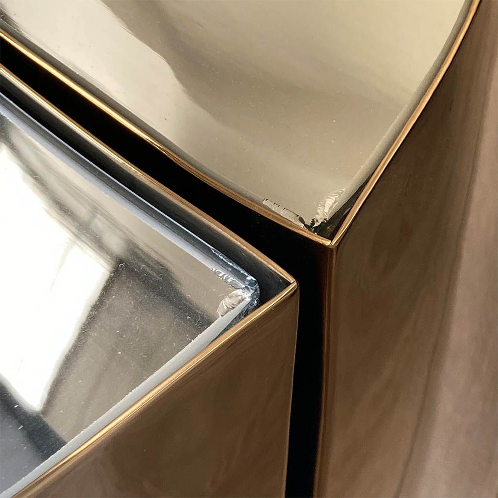 Chip to edge of glass on crescent-shaped table