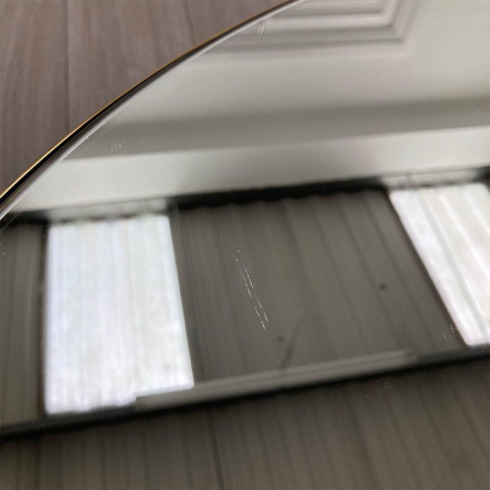 Scratch on mirror surface of larger round table