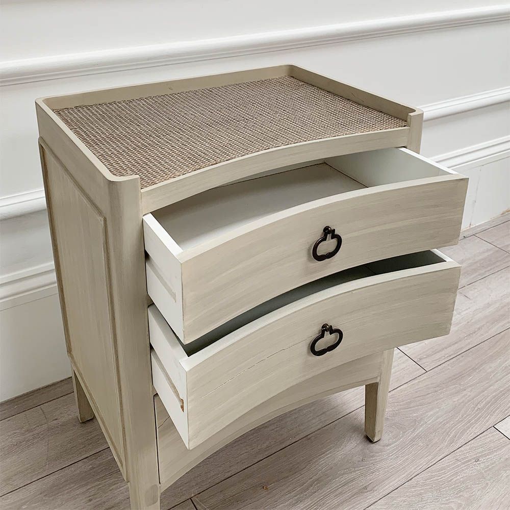 White washed three door bedside cabinet with some splits to the wood. 