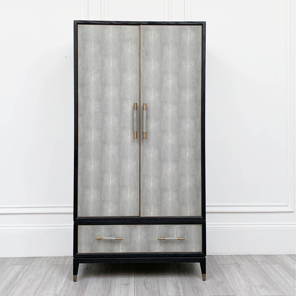 A luxurious grey shagreen wardrobe with antique brass and black detailing 