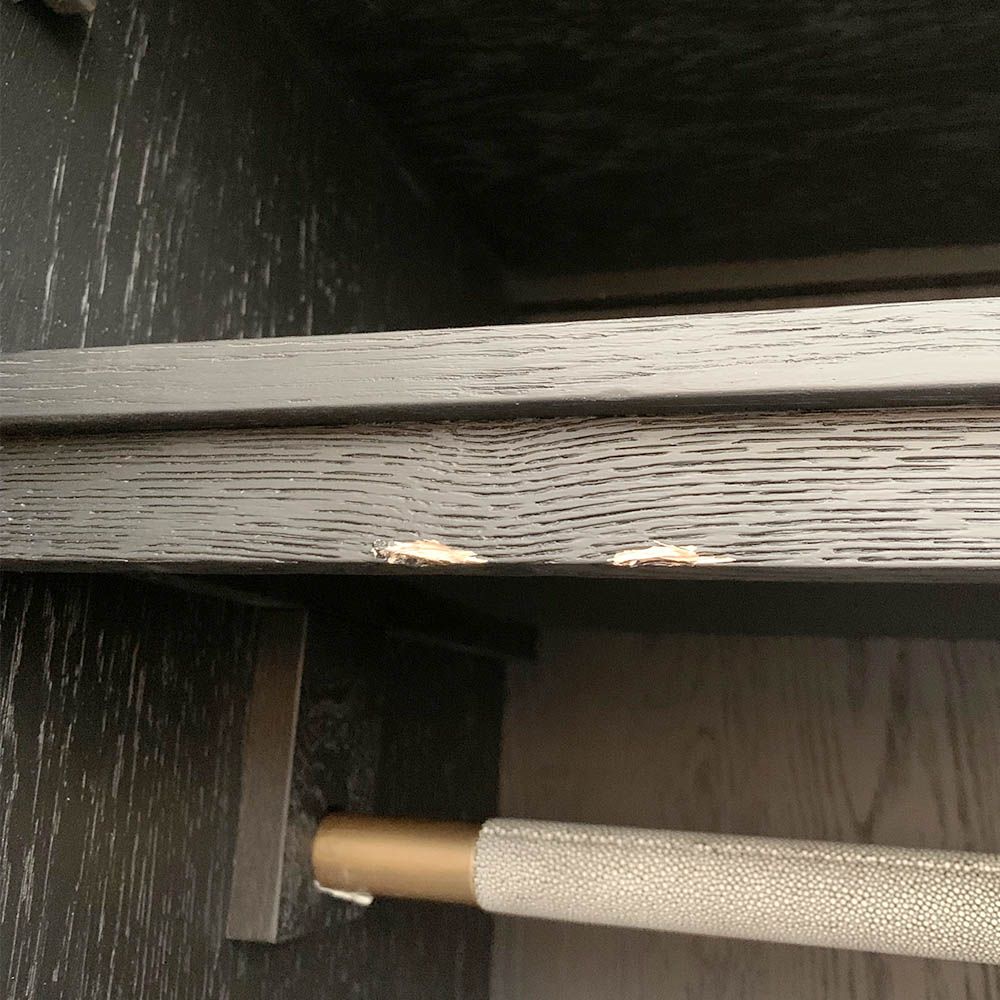 A luxurious grey shagreen wardrobe with antique brass and black detailing 