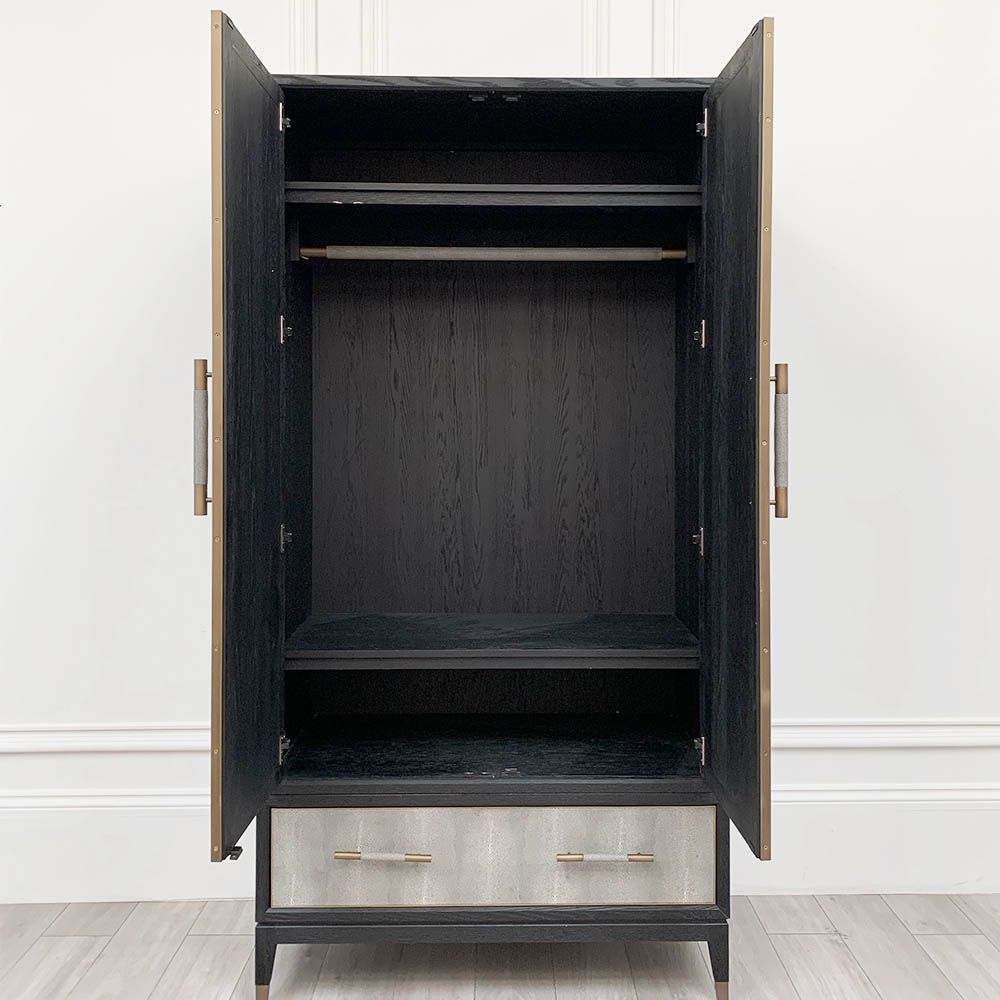 A luxurious grey shagreen wardrobe with antique brass and black detailing 