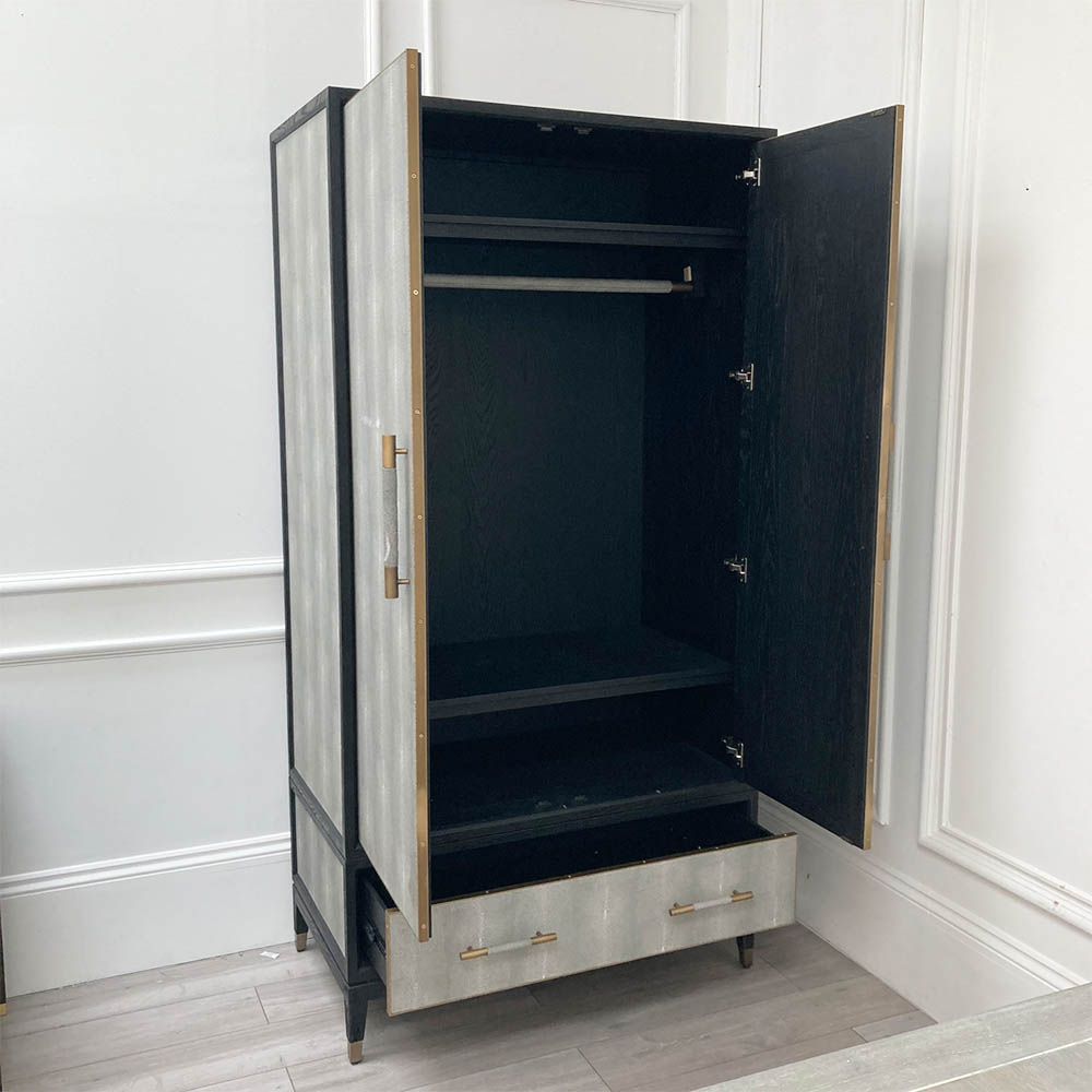 Grey shagreen finish wardrobe complemented by brass accents