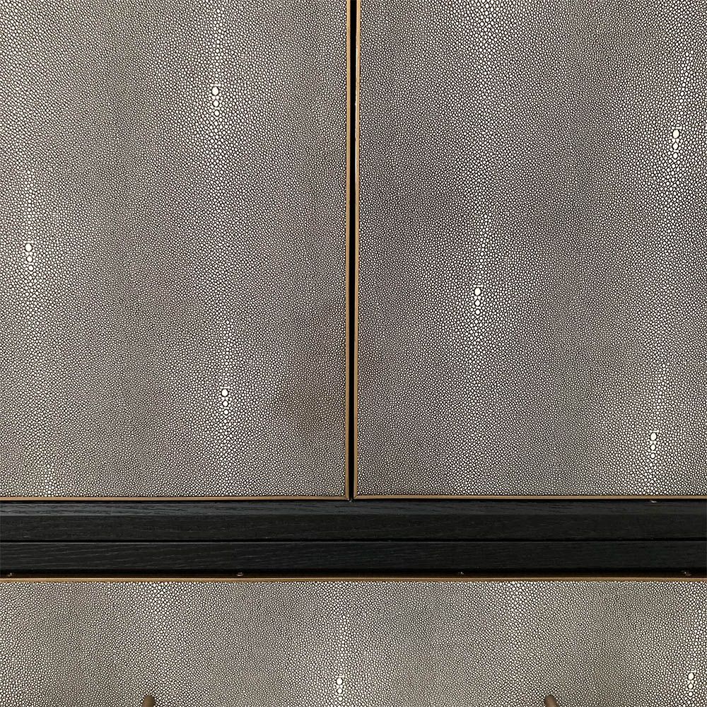 Grey shagreen finish wardrobe complemented by brass accents