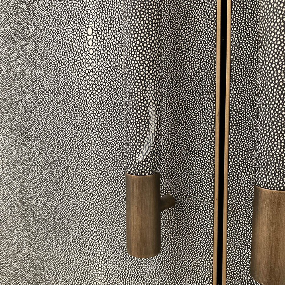 Grey shagreen finish wardrobe complemented by brass accents