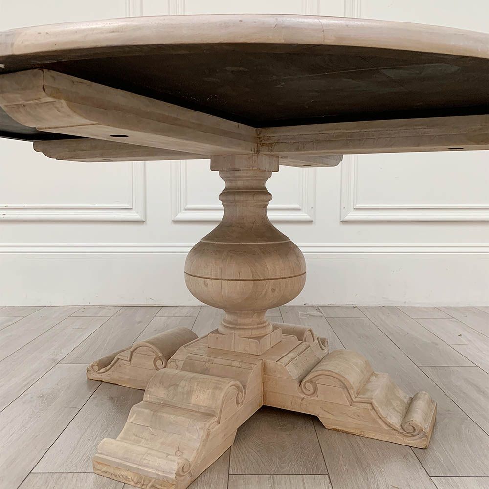 Elegant round dining table with washed wood finish