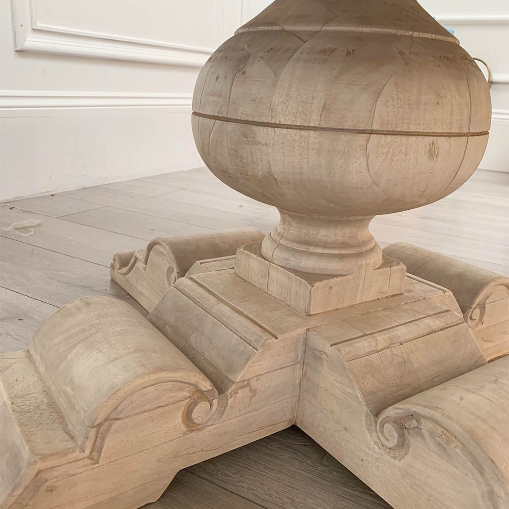 Elegant round dining table with washed wood finish