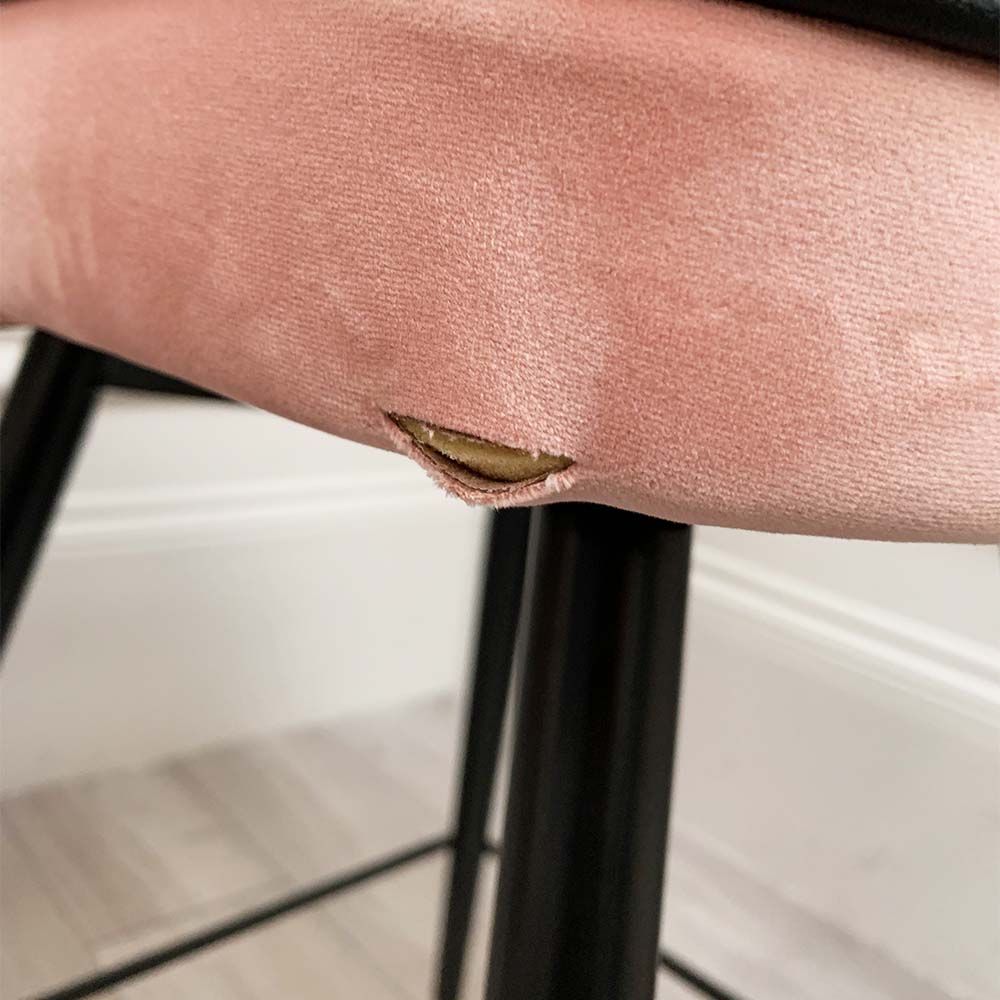 A pair of pink velvet mid-century counter stool with black faux leather piping and golden feet caps