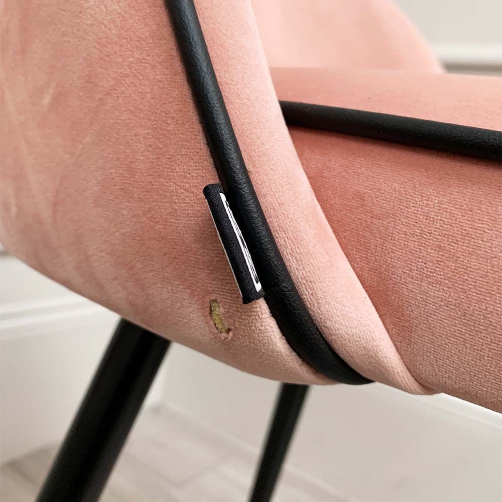 A pair of pink velvet mid-century counter stool with black faux leather piping and golden feet caps