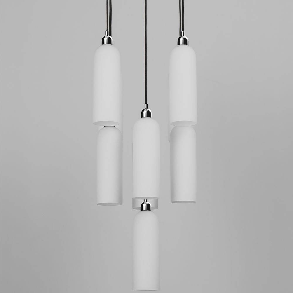 A luxury chandelier by Schwung with 9 frosted, opal glass shades and a glamorous polished nickel finish 