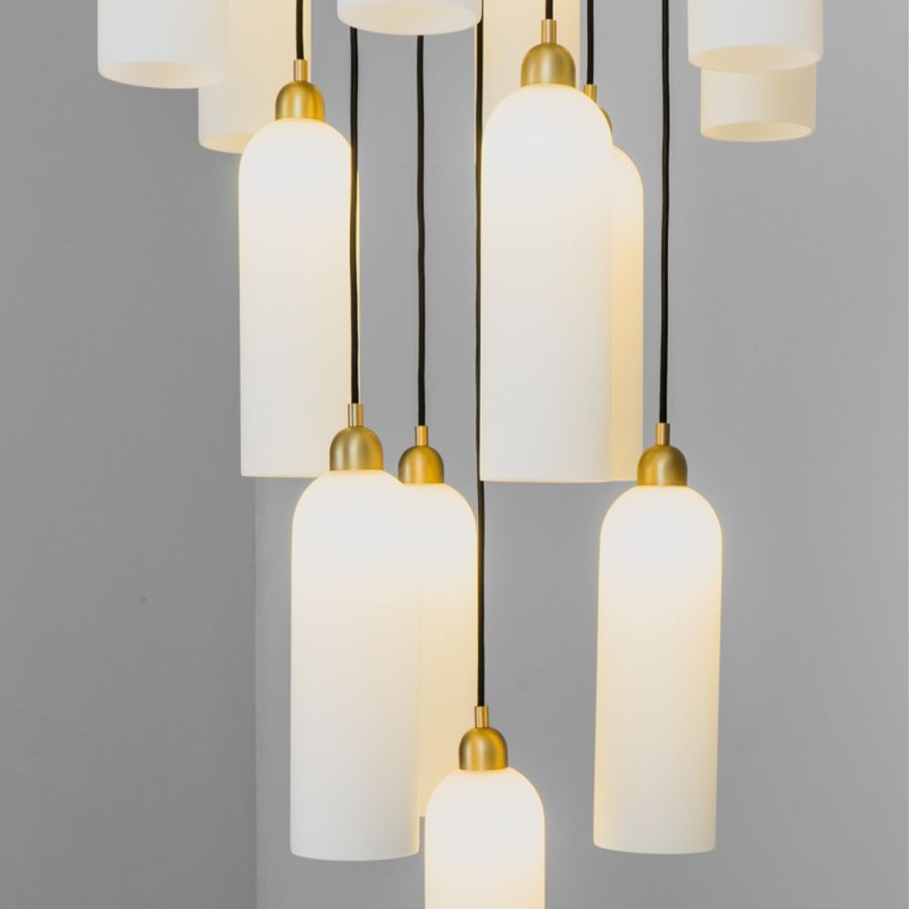 A luxurious chandelier by Schwung with translucent opal glass lampshades and a solid brass structure