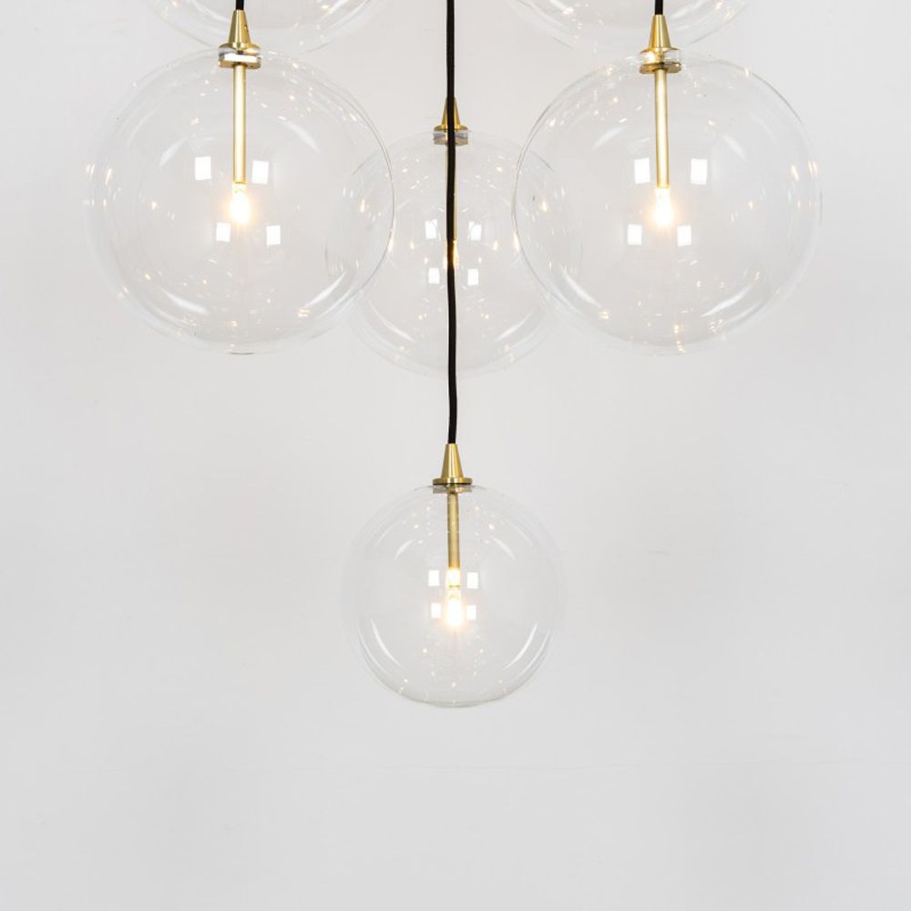 Glamorous industrial chandelier with multiple hanging clear glass globe lampshades
