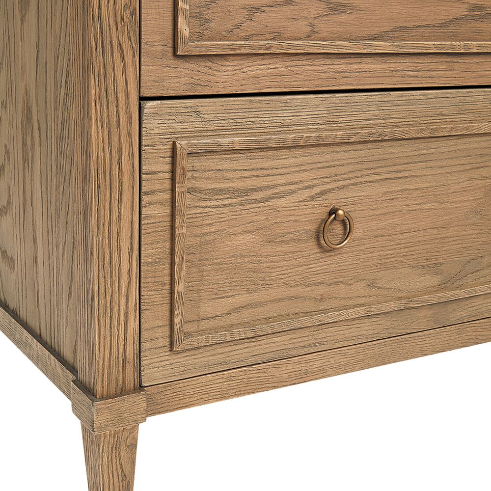 A stylish minimalist oak and plywood three drawer chest of drawers with brass handles