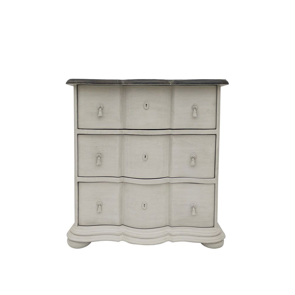 A luxurious putty-toned distressed French-style chest of drawers