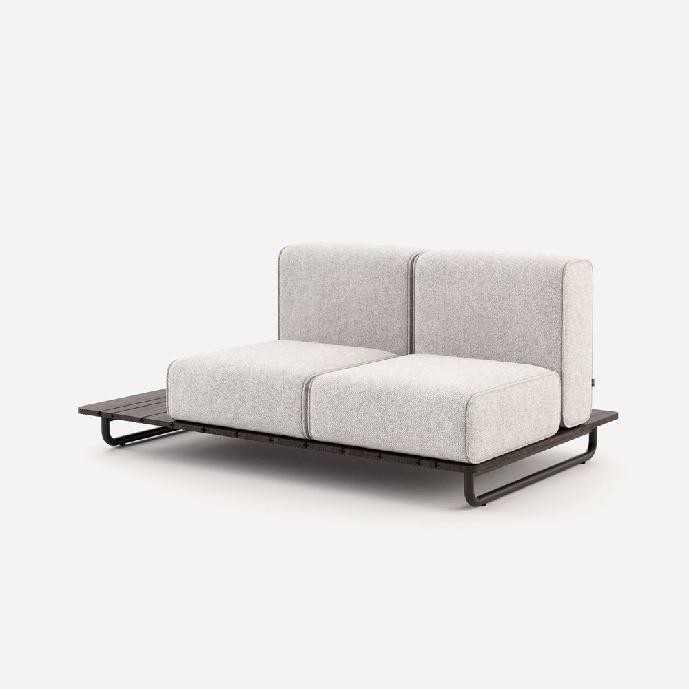 A stylish outdoor sofa upholstered in a natural-toned fabric on a painted steel base