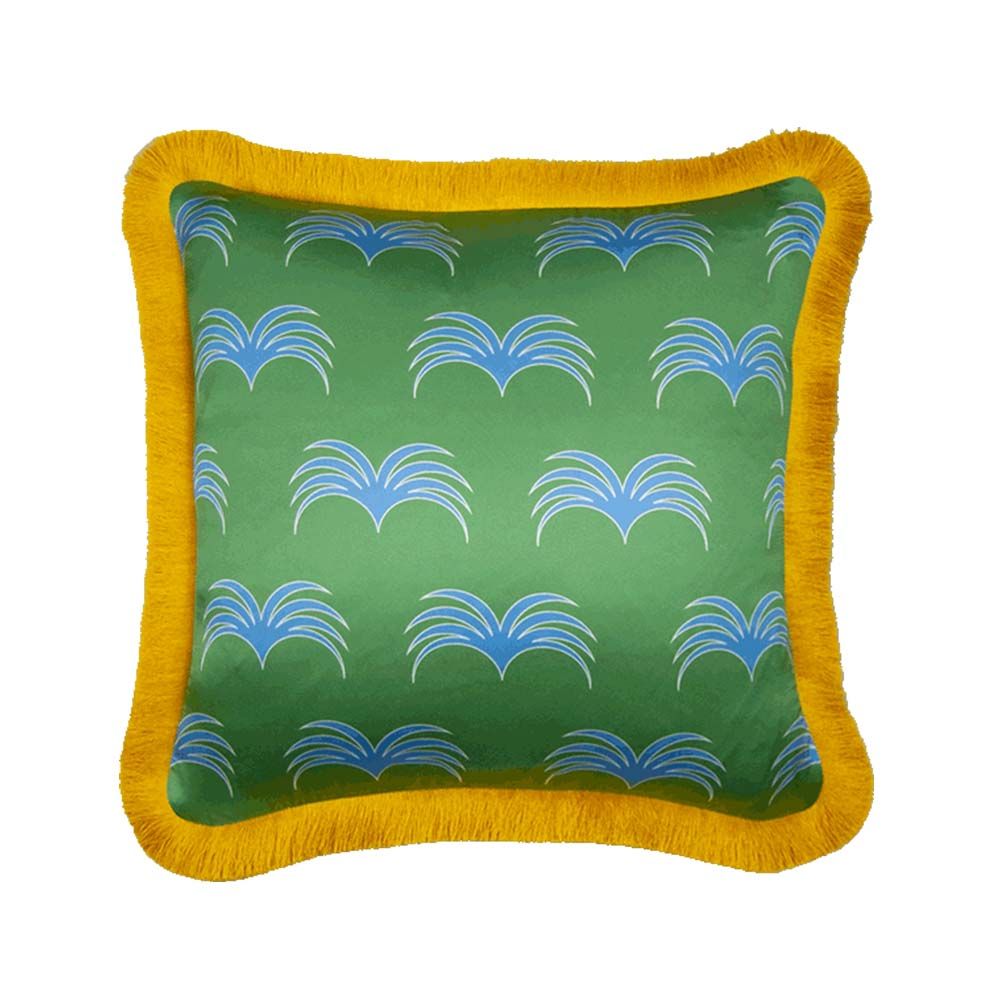 A gorgeous green cushion with a blue pattern and an elegant mustard fringe