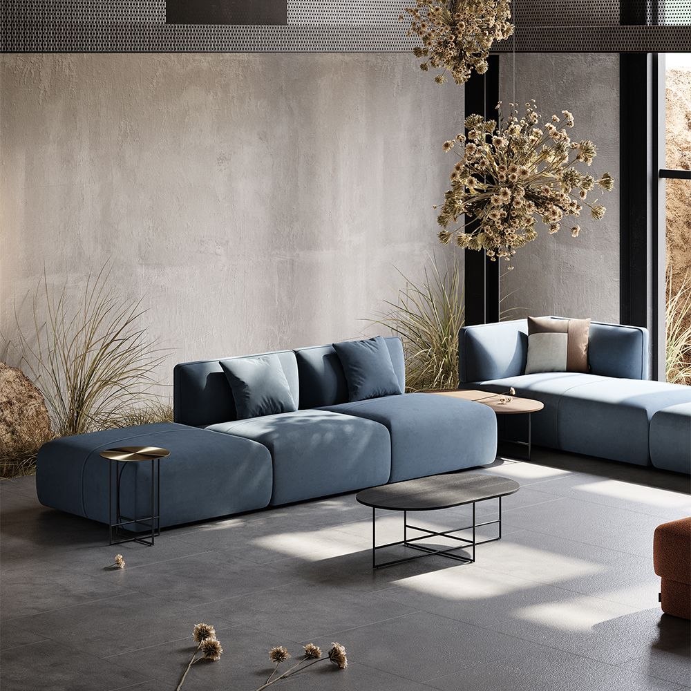 Luxury, large sofa upholstered in a beautiful blue fabric, with curvy, contemporary design