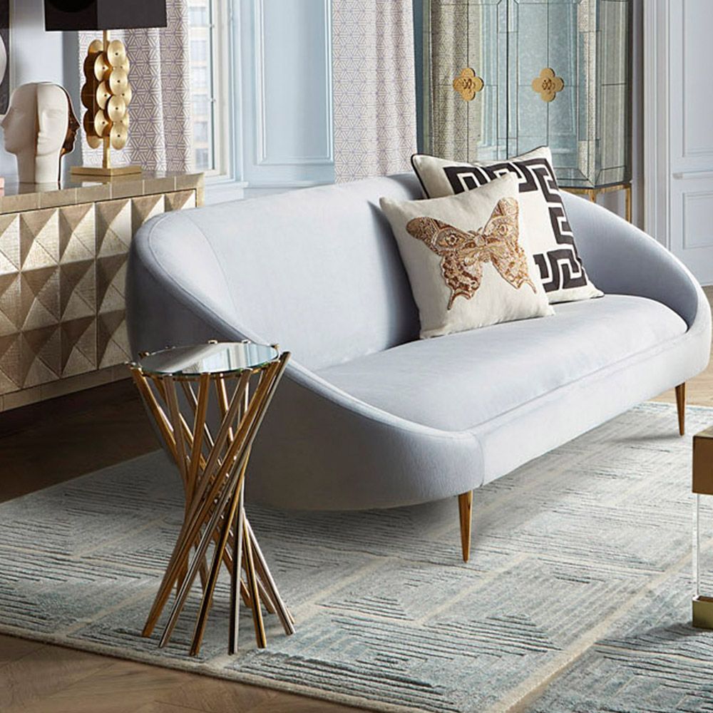 a glamorous nickel and brass table with a mirrored surface 