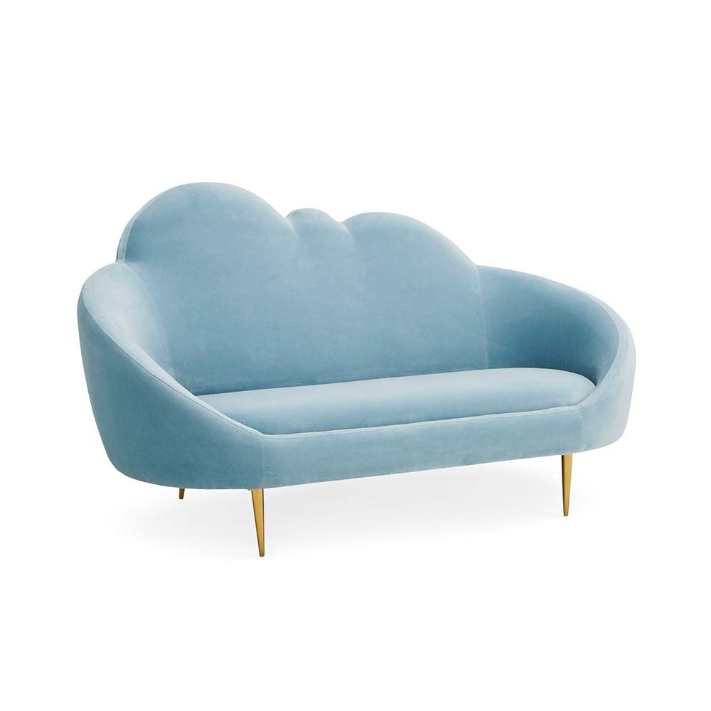 The luxurious sky blue ether cloud sofa by Jonathan Adler with polished brass feet