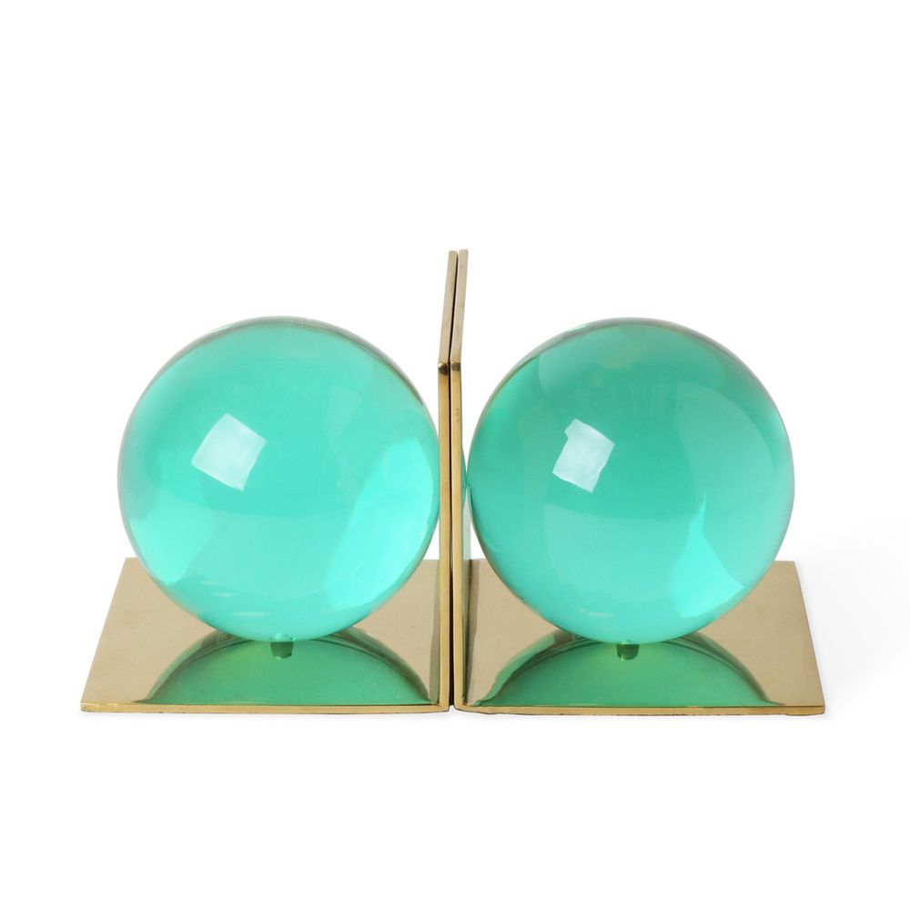 A stylish pair of green, acrylic bookends with brass bases