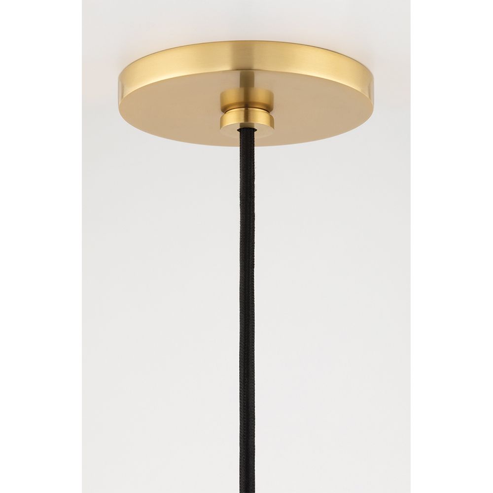 A contemporary clear glass bell-shaped pendant with an industrial feel by Hudson Valley 