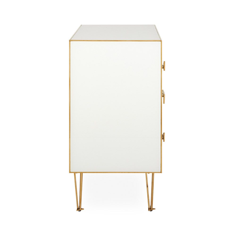A modern Italian-inspired chest of drawers with angular hardware and brass accents