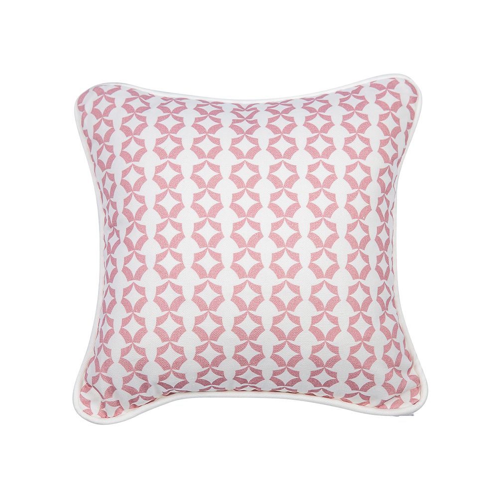 A gorgeous pink children's cushion with a unique pattern and white piping