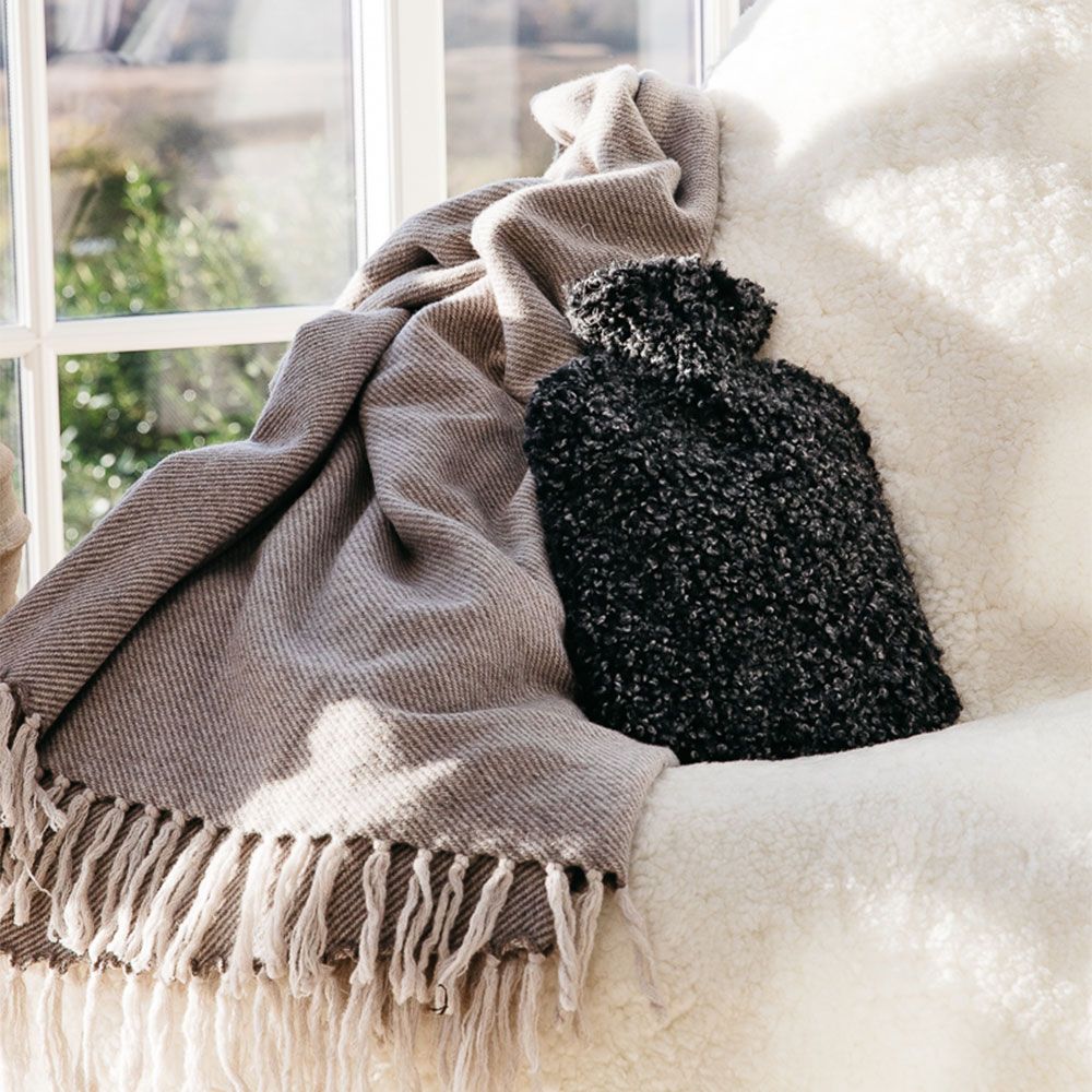 A luxurious and sumptuously soft sheepskin hot water bottle
