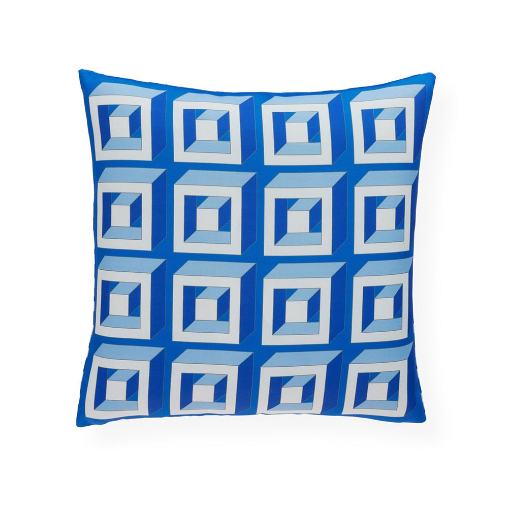 A bold and beautiful blue cushion by Jonathan Adler with a graphic and reversible design